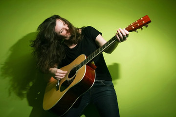 Young woman playing guitar