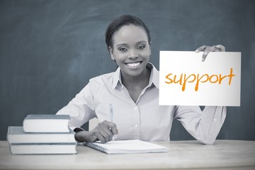 Happy teacher holding page showing support