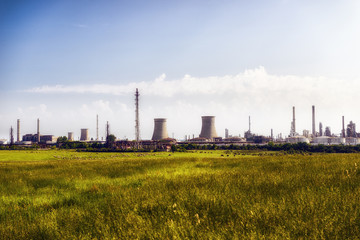 Fototapeta na wymiar oil refinery plant against blue sky