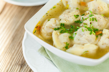 Dish of savory pork tortellini in broth pelmeni russian