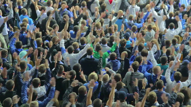 Multiple claps hands in the air football supporters stadium game