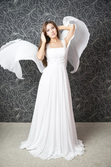Fototapeta premium Beautiful indian woman in white wedding dress