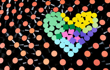 Love music,a collection of vinyl records and a colorful heart