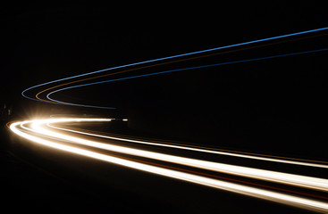 Car light trails in the tunnel.