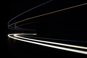 Car light trails in the tunnel.