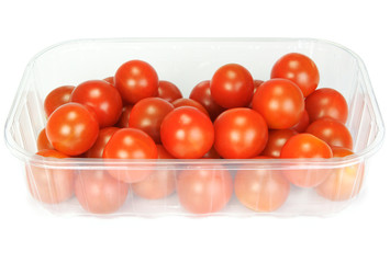 Cherry tomatoes in a plastic container on white background