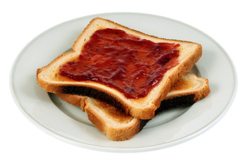 Assiette de tranches de pain de mie et confiture