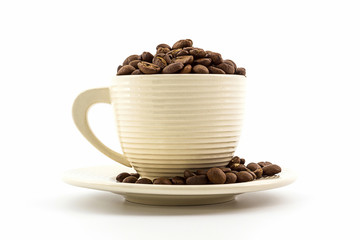 Brown roasted coffee beans in coffee cup