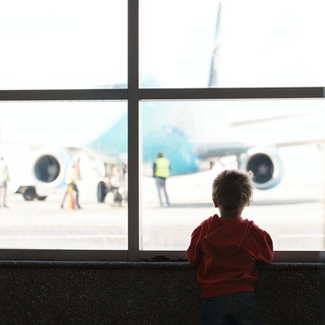 Boy looks at the plane