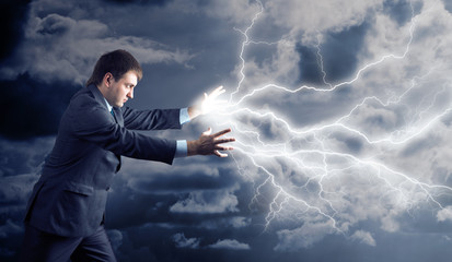 Young man with lightnings from his hands