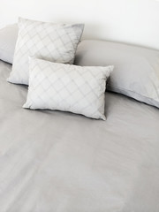 Grey bed linen and pillows