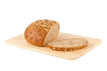 Sliced loaf of homemade bread on a wooden cutting board