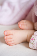 Feet of a sleeping five months old baby