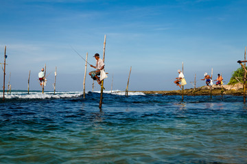 Sri Lankan traditional fisherman on stick in the Indian ocean