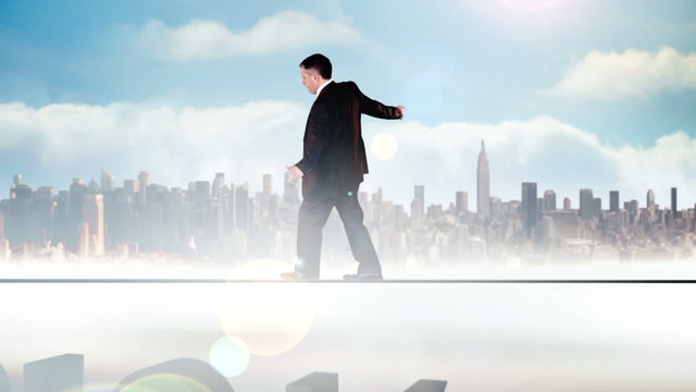 Businessman walking across tightrope with risk text