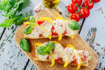 Bruschetta with tomatoes and bell peppers mozzarella