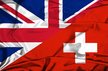 Waving flag of Switzerland and UK