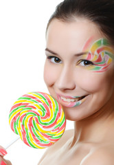 Fototapeta na wymiar The girl with a sugar candy isolated on white