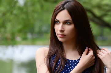 Fototapeta premium Beautiful young girl in summer park