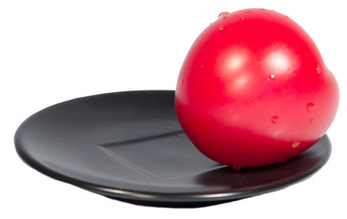 Tomato red on black plate