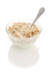 healthy cereal rings in a glass bowl with yogurt