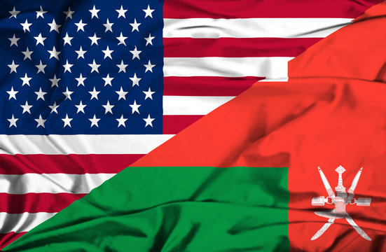 Waving flag of Oman and USA