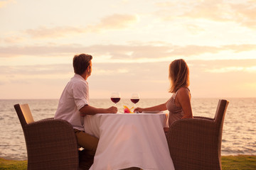 Couple enjoying romantic sunnset dinner