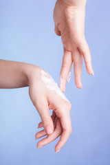 Skin care. Female palms with moisturizing cream.