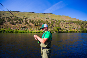 Fly Fisherman Casting on the Deschutes River