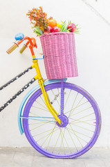 Fototapeta na wymiar Bicycle with basket fruit and flower
