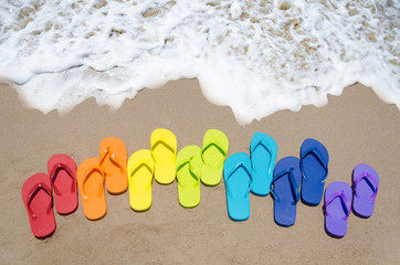 Color flip flops by the ocean