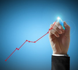 Business man hand drawing graph