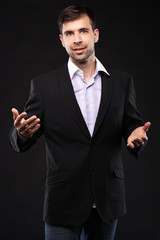 Young businessman in a black suit