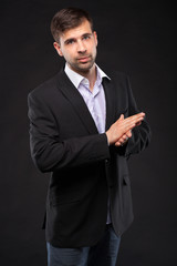 Young businessman in a black suit