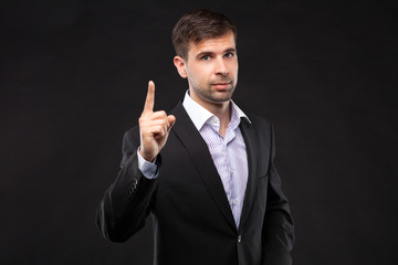 Young businessman in a black suit