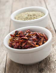 Dry chilly close up top view on wood