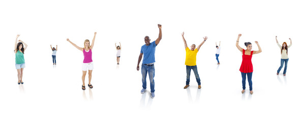 Multi-Ethnic Group Of People With Their Arms Raised