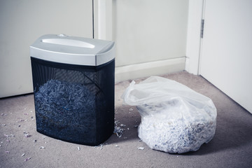 Paper shredder and bag of shredded documents