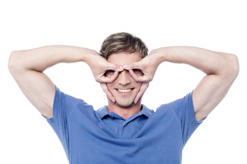 Handsome young man gesturing and smiling