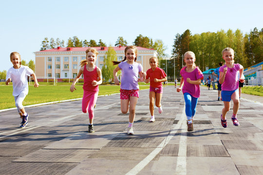 group of children running on the treadmill