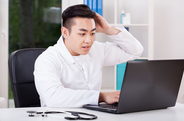 Asian doctor during work