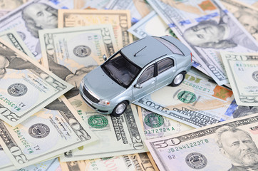 Car model on dollar bills