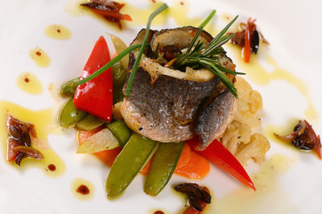 Sea bass fillet with spring vegetables