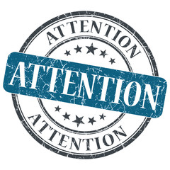 Attention blue round grungy stamp isolated on white background