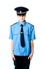 Boy in police uniform with gun