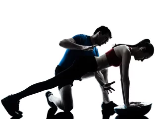 Foto op Plexiglas coach man woman exercising abdominals with bosu silhouette © snaptitude