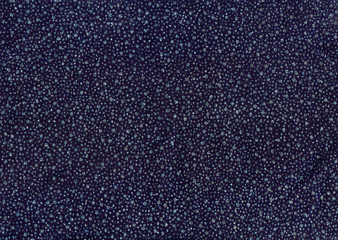 Texture of dark blue cloth with silver and blue sequins as backg