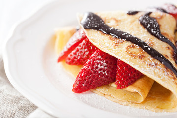 pancakes with strawberry and chocolate sauce