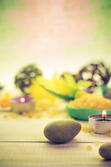 Obraz na płótnie Canvas Zen stones scented candle wooden background
