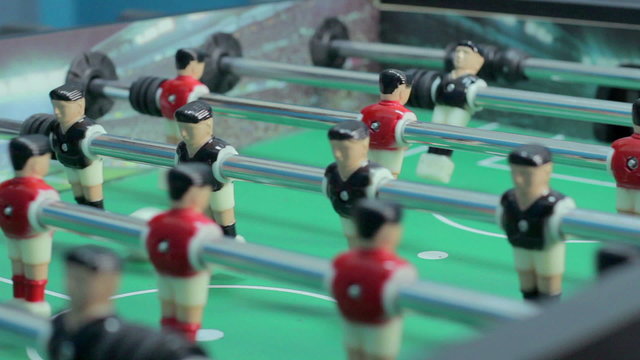Close-up view table soccer figures, team-building, having fun